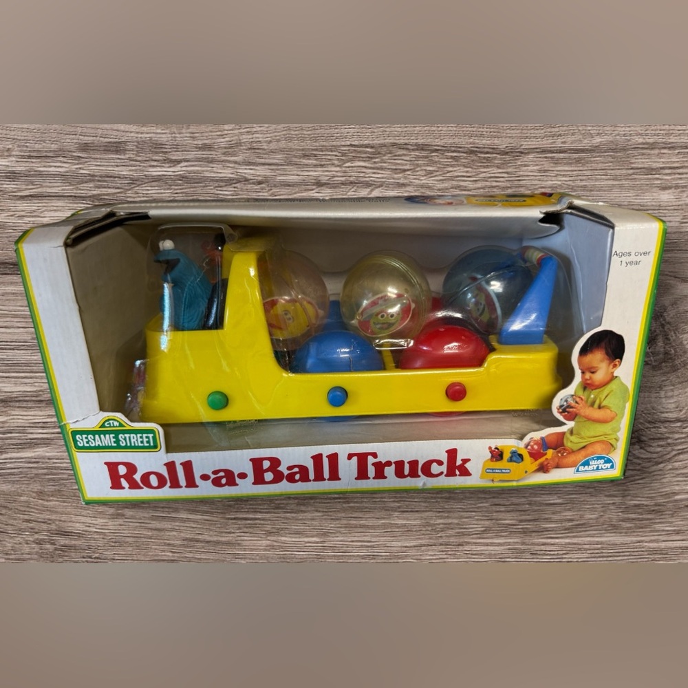 NIB Vintage 1990 Sesame Street Roll-A-Ball Pull Toy Truck